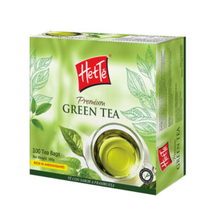 Premium green tea box by Heté with 100 tea bags and green botanical design, cup of tea shown on front.