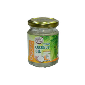 Small glass jar of organic virgin coconut oil with a gold lid and green label showing coconuts on front