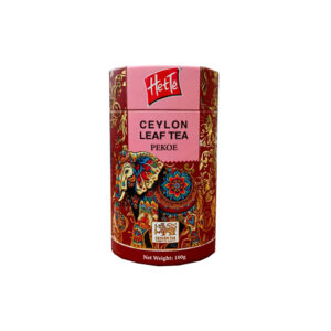 Ceylon leaf tea tin with pink and red ornate packaging, elephant design, and 'Ceylon Leaf Tea Pekoe' text (net weight 100g)