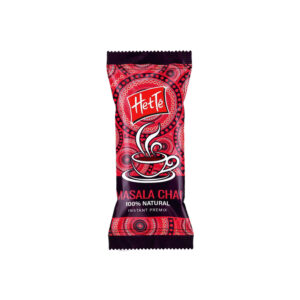 HetTe Masala Chai instant premix sachet with red patterned design and steaming cup illustration on front (brand name visible).